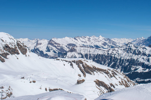Swiss mountain peak after snowfall with panoramic view of Murren Jungfrau ski region. - Photo, Image
