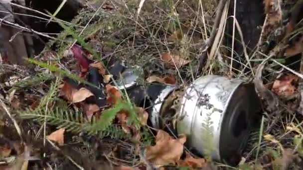 an old torn gas mask lying in the bushes - Felvétel, videó