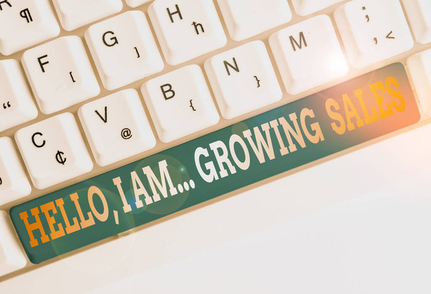 Text sign showing Hello I Am Growing Sales. Conceptual photo Making more money Selling larger quantities White pc keyboard with empty note paper above white background key copy space. - 写真・画像
