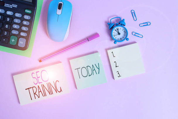 Conceptual hand writing showing Seo Training. Business photo text learn specific knowledge improve perforanalysisce in current roles Notepads alarm clock calculator sheet marker colored background. - Fotoğraf, Görsel
