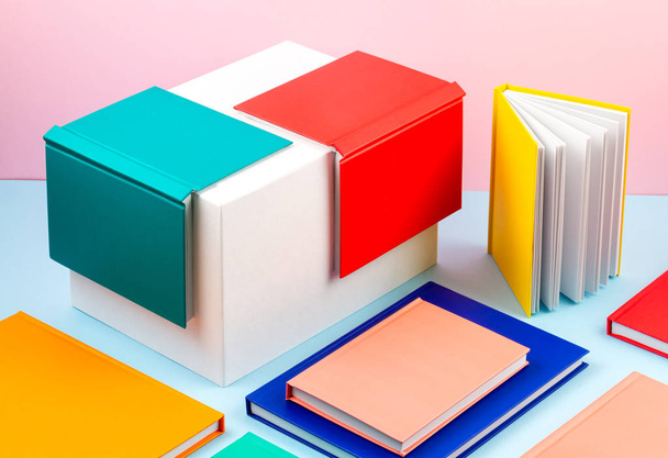 Colorful notebooks over the blue pastel background. Modern abstr - Foto, Imagem