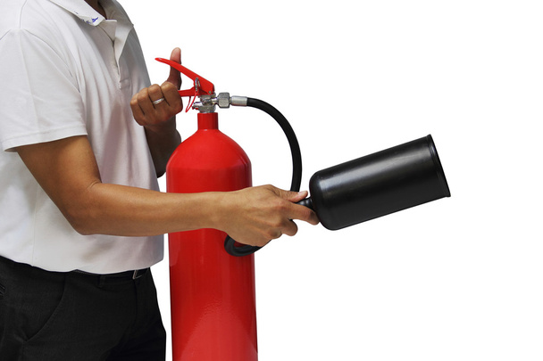 A man showing how to use fire extinguisher isolated over white b - Foto, Bild
