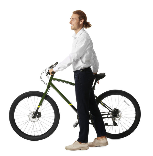 Happy young man with bicycle on white background - Zdjęcie, obraz