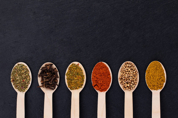 Various spices on dark background. Top view with copy space - Φωτογραφία, εικόνα