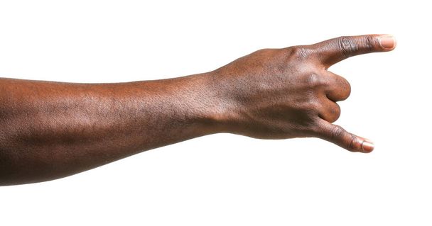 Käsi Afrikkalainen-Amerikkalainen mies osoittaa "paholainen sarvet" ele valkoisella taustalla
 - Valokuva, kuva