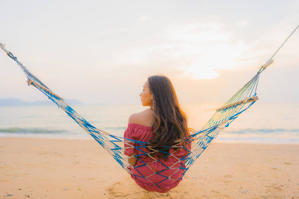 Portrait beautiful young asian woman sitting on the hammock with - Photo, Image