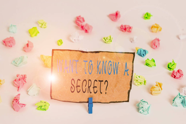 Text sign showing Want To Know A Secret Question. Conceptual photo to divulge a confidential vital information Colored crumpled papers empty reminder white floor background clothespin. - Photo, Image