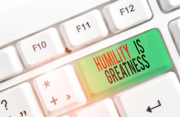 Text sign showing Humility Is Greatness. Conceptual photo being Humble is a Virtue not to Feel overly Superior White pc keyboard with empty note paper above white background key copy space. - Photo, Image