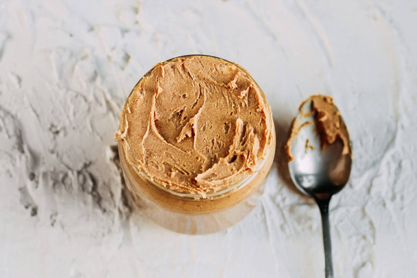 thick peanut butter close-up. Healthy eating - Foto, afbeelding