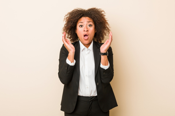Young business african american woman surprised and shocked. - Photo, Image