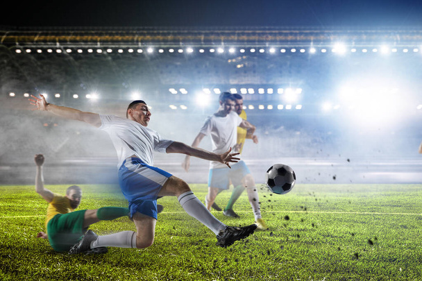 Soccer players on stadium in action - Фото, зображення