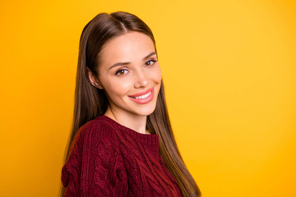 Close up photo of nice lady looking having long hairstyle wearing maroon sweater isolated over yellow background - Photo, image