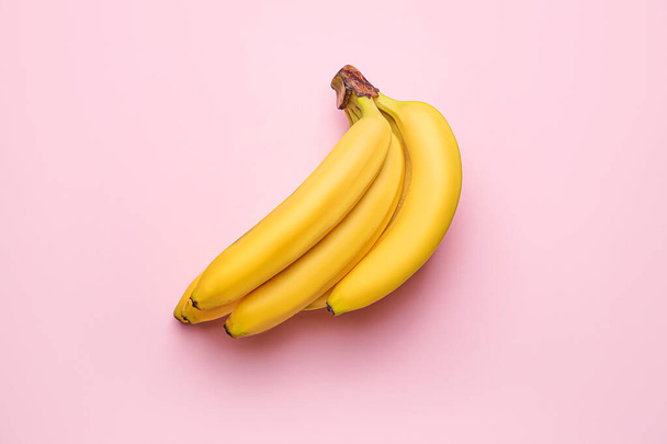 Ripe bananas on color background - Zdjęcie, obraz