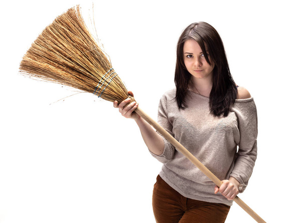 Young woman with a broom - Photo, Image