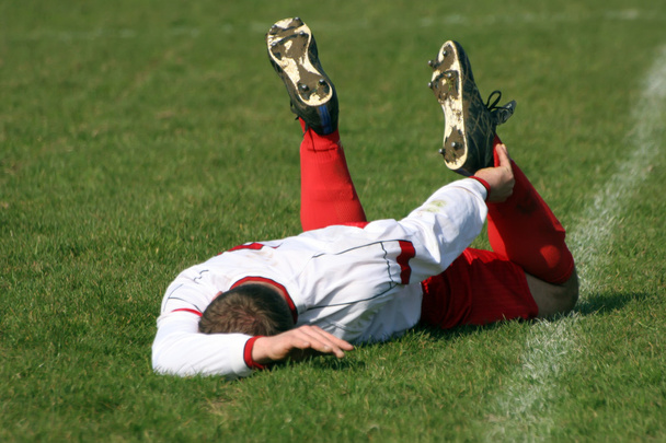 Un footballeur blessé
 - Photo, image