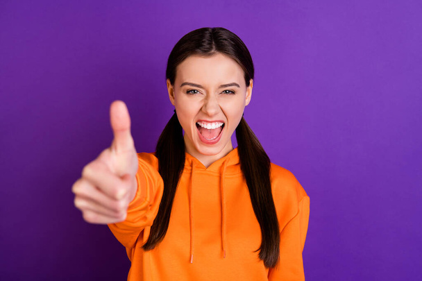 Close-up portrait of her she nice attractive cheerful cheery content girl with pigtails showing giving thumbup trust isolated over bright vivid shine vibrant violet purple lilac color background - Foto, imagen