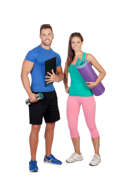 Handsome personal trainer with a attractive girl - Foto, imagen