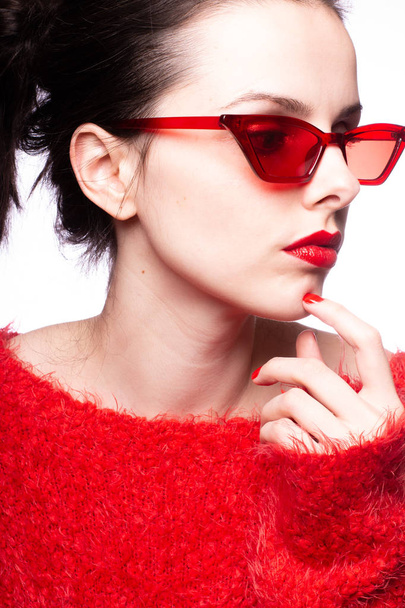 young woman in red sunglasses, red lipstick, red sweater - Φωτογραφία, εικόνα