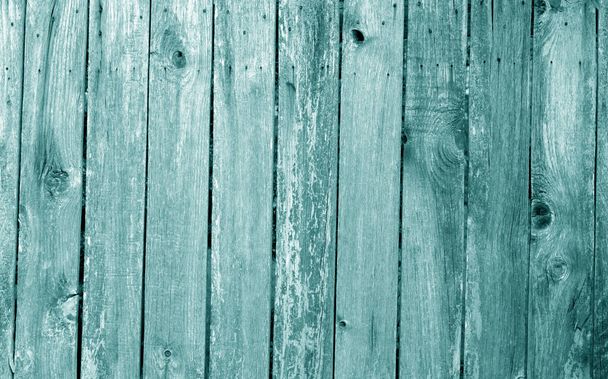 Weathered wooden fence in cyan color. - Photo, Image