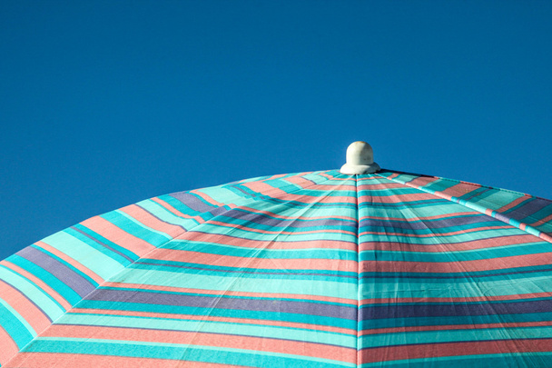 Blue sky with blue umbrella - Zdjęcie, obraz