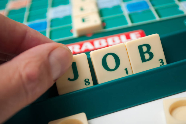 plastic letters on Scrabble board game forming the word : Job - Fotoğraf, Görsel