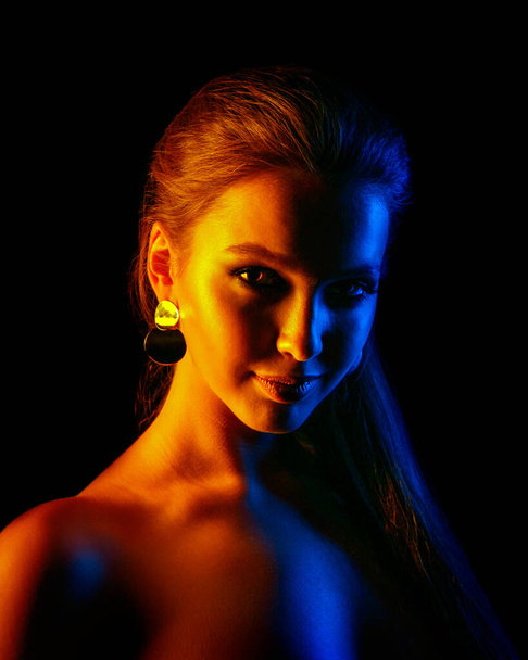 Beautiful sexy woman in colorful design and glitter vivid neon l - Photo, image