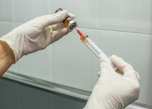 Nurse with vaccine in syringe - Photo, Image