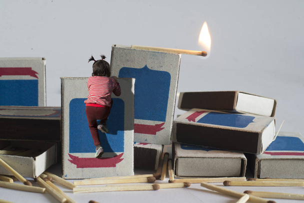 Children play with matches. The concept of a match is not a toy for children. - Fotografie, Obrázek