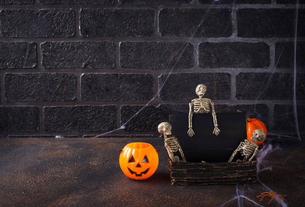 Halloween background with skeletons and tomb - Photo, Image
