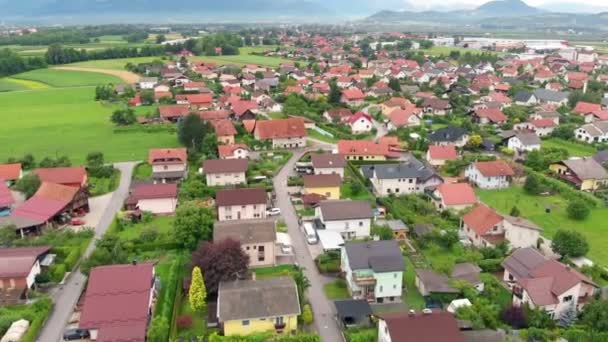 We can see a beautiful small town located in the middle of the countryside. Aerial shot. It's a beautiful day. - 映像、動画