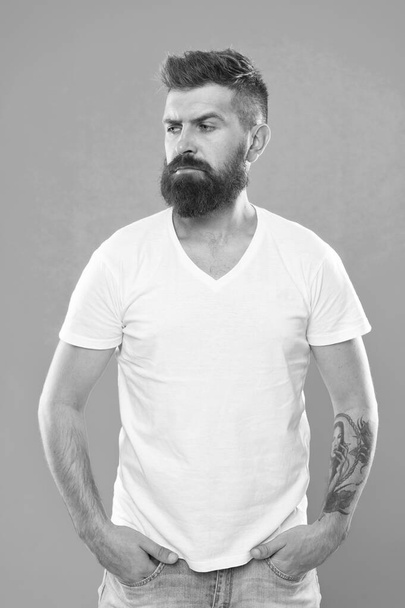 Styling beard supplies. Beard fashion and barber concept. Man bearded hipster stylish beard turquoise background. Barber tips maintain beard. Stylish beard and mustache care. Hipster appearance - Photo, Image