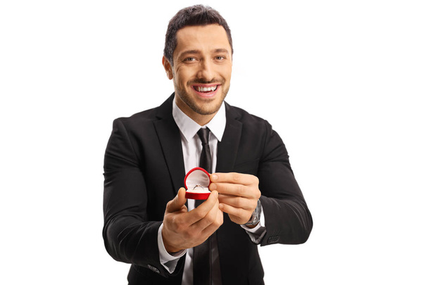 Handsome young happy man proposing with a ring - Fotografie, Obrázek