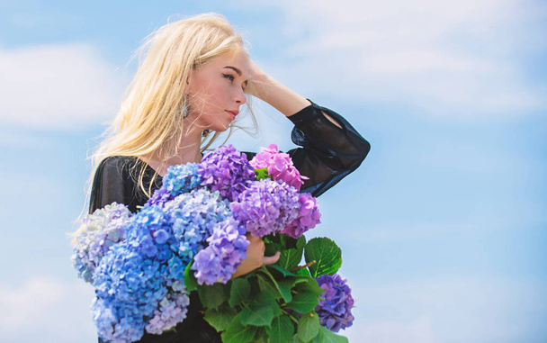 Pollen allergy. Springtime bloom. Female adore flowers. Spring attributes. Enjoy spring without allergy. Allergy free life. Stop allergy blooming season. Girl tender blonde hold hydrangea bouquet - Photo, Image