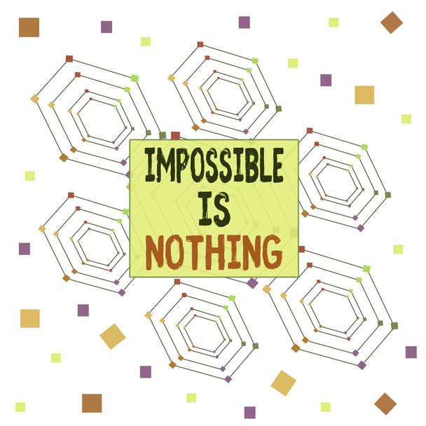 Text sign showing Impossible Is Nothing. Conceptual photo Anything is Possible Believe the Realm of Possibility Centered Hexagon Concentric Pattern Randomly Scattered Colored Squares. - 写真・画像