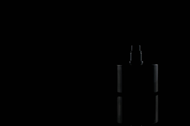 silhouette of a black bottle with a men's perfume - Fotoğraf, Görsel