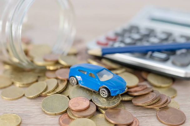 car with coins and calculator, expenses and car purchase - 写真・画像