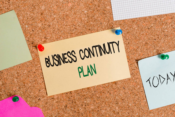 Writing note showing Business Continuity Plan. Business photo showcasing creating systems prevention deal potential threats Corkboard size paper thumbtack sheet billboard notice board. - Photo, Image