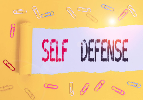 Handwriting text Self Defense. Concept meaning the act of defending one s is demonstrating when physically attacked. - Photo, Image