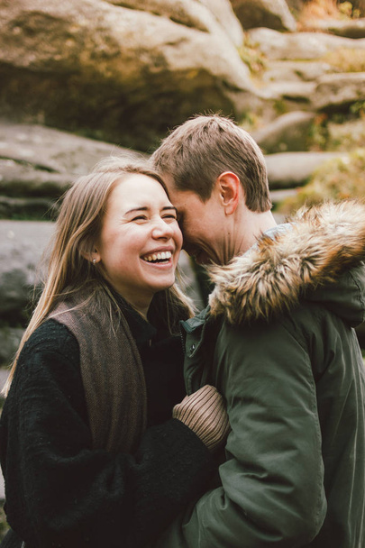 Happy young couple in love friends dressed in casual style walking together on nature park forest in cold season, family advenure travel - Photo, Image