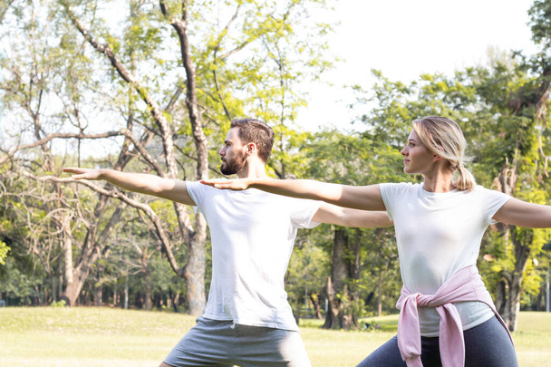 Couples are exercising in the park. - Photo, Image