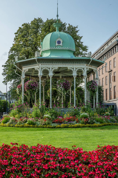 A gazebo covered in flowers in the center of Bergen in Norway in - Photo, image