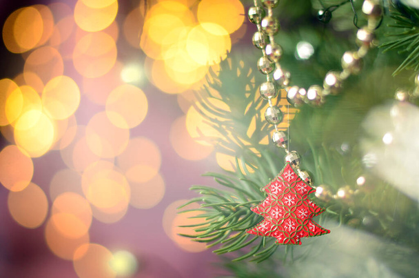 Christmas and New Year Background with Holiday Decoration garland. Abstract Blurred Bokeh Holiday Backgdrop. Christmas Tree Lights. - Photo, image
