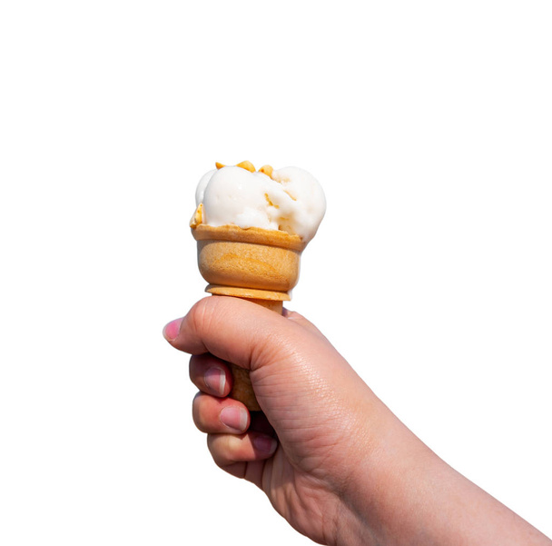Hand with ice cream isolated on white background - Photo, image