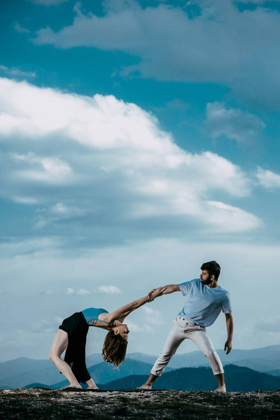 Attractive couple dancing hip-hop. Skillful modern style teenagers dancing contemporary dance - Fotoğraf, Görsel