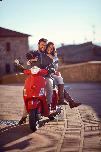 romantic man and woman having fun on scooters. Young couple ridi - Foto, Imagem