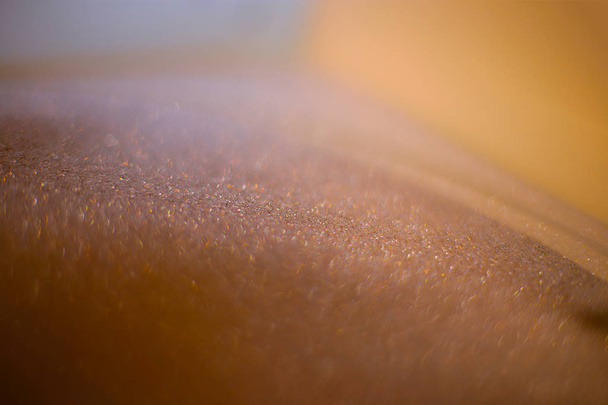 Sfondo sabbia lustrini friabili, bokeh con tremolante scintillio iridescente
 - Foto, immagini