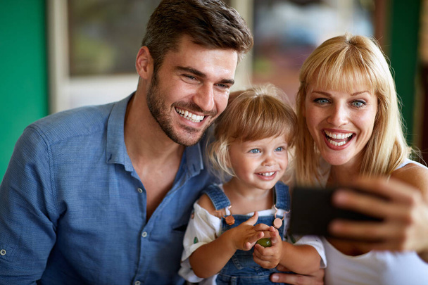 Mom with cell phone making selfie with family - Zdjęcie, obraz