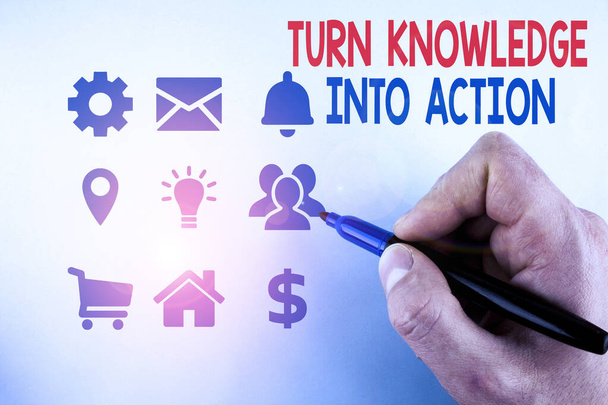 Writing note showing Turn Knowledge Into Action. Business photo showcasing Apply what you have learned Leadership strategies Male designing layout presentation concept for business promotion. - Photo, Image
