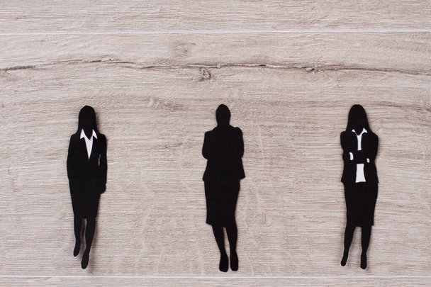 Black paper figures of business ladies. - Foto, Imagem