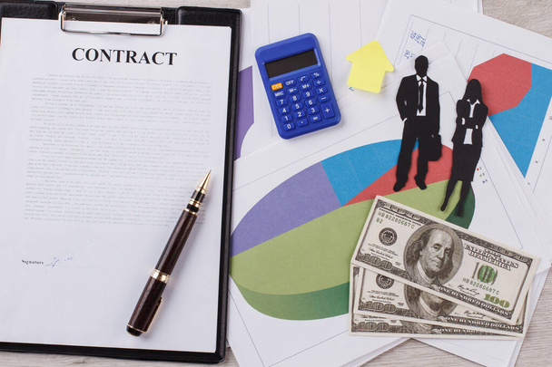 Signed contract. Business people figures. - Photo, Image
